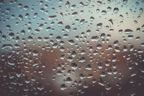 Photo of water drops on glass.