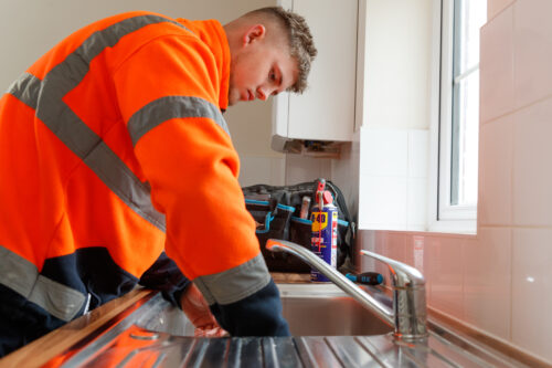 Image of a Greatwell Works operative fixing a sink.