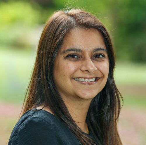 Headshot of Selina, Income Team Leader, smiling at the camera.